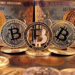 Bitcoins and Bitcoin themed banknotes in various designs