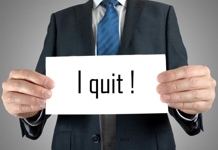 195128024 featured image Person holding a sign saying I quit!