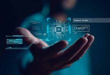 Hand holding digital AI and ChatGPT graphics