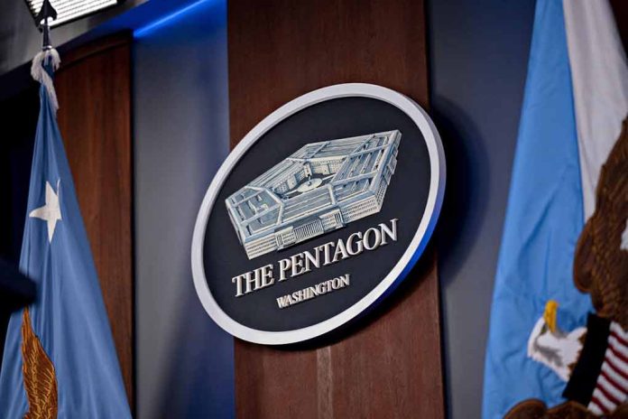 2265798341 featured image The Pentagon emblem between two flags.