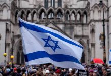 Israeli flag at a crowded outdoor event