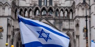 Israeli flag at a crowded outdoor event