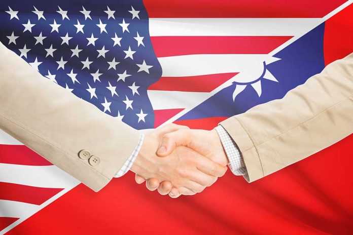 283346210 featured image Two people shaking hands with USA Taiwan flags