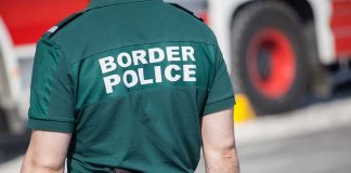 Person in Border Police uniform standing outdoors