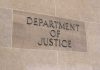 Department of Justice sign on stone building