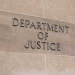 Department of Justice sign on stone building