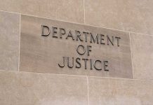 Department of Justice sign on stone building