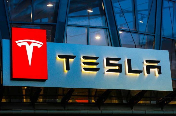 1140629366 featured image Tesla logo on a building at night