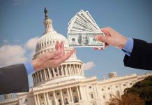 Hands exchanging money in front of Capitol building