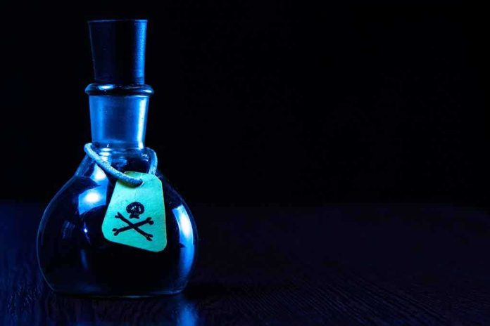 Dark bottle with skull and crossbones label on table