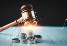 Gavel coins and tax icons on a table