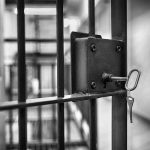 Jail cell door with key in lock