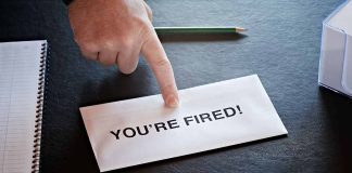 Envelope with YOU RE FIRED and pointing finger