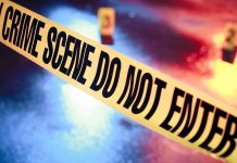 Crime scene tape with do not enter text