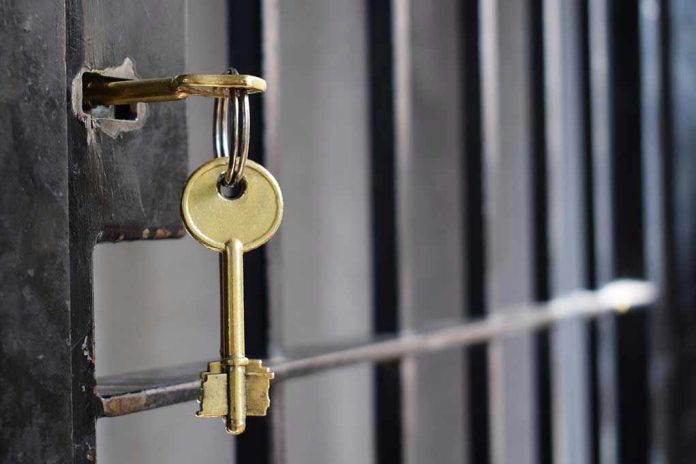 Key in lock of prison cell door