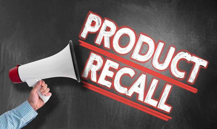 1411356206 Person holding megaphone, "Product Recall" text.