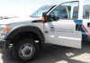 U.S. Customs and Border Protection truck with open door.