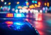 Police car with flashing lights at night