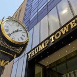 Clock in front of Trump Tower building entrance