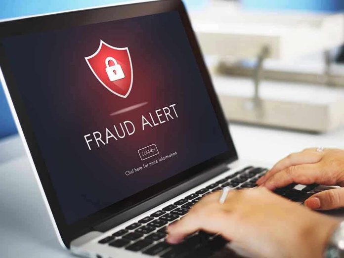 412668235 Laptop displaying fraud alert warning on screen