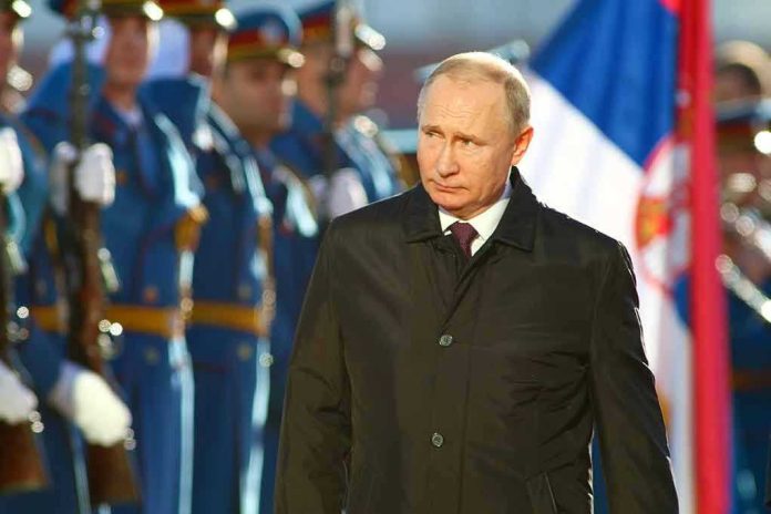 83211922 A man in dark coat at a military event