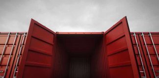 Open red shipping container with a view into the empty interior