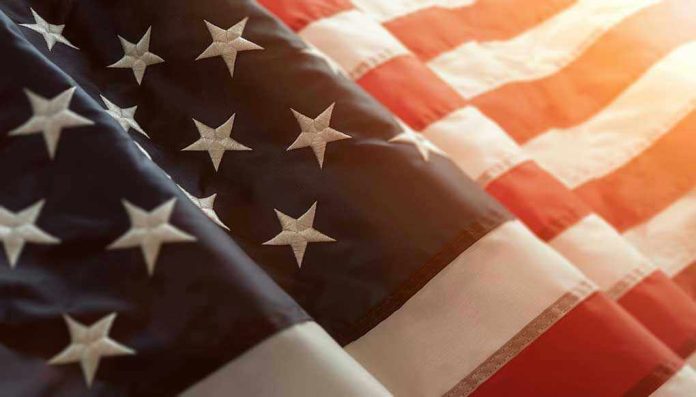 1071381386 Close-up of American flag with sunlit background.