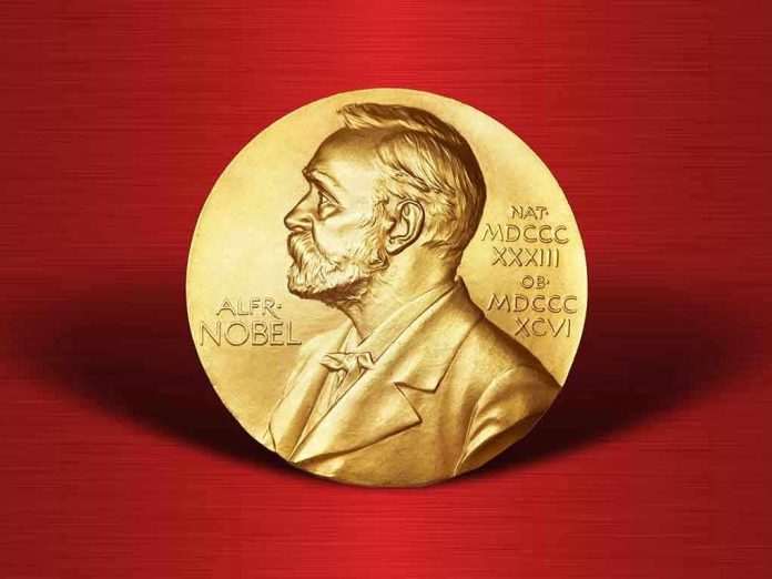 Gold Nobel Prize medal on red background