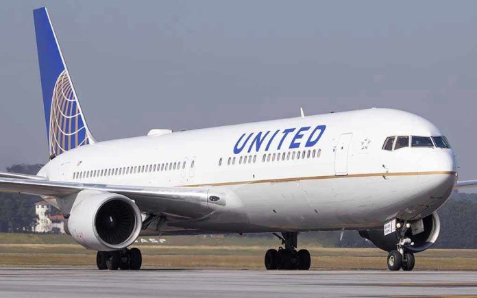 623296490 United Airlines plane on the runway.