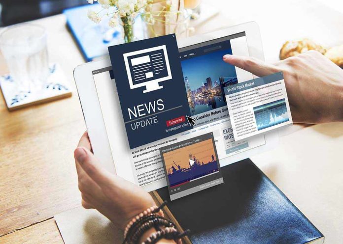 462623761 Person reading digital news on a tablet device
